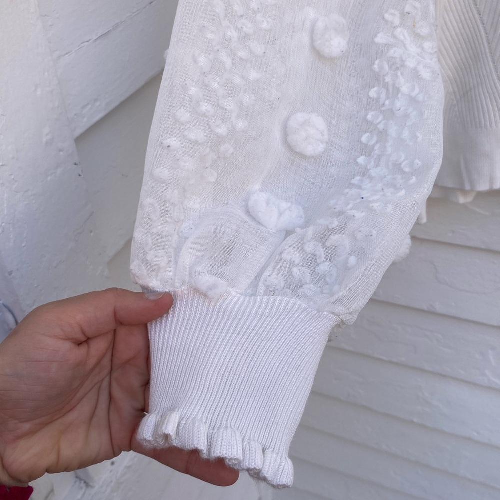 Elegant White Knit Women's Top with Sheer Sleeves and Pom-Poms - Picture 2 of 6